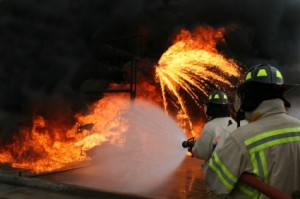 Fire fighters putting out a building fire